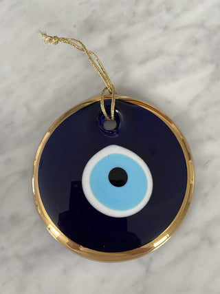 Glass eye ornament in gold